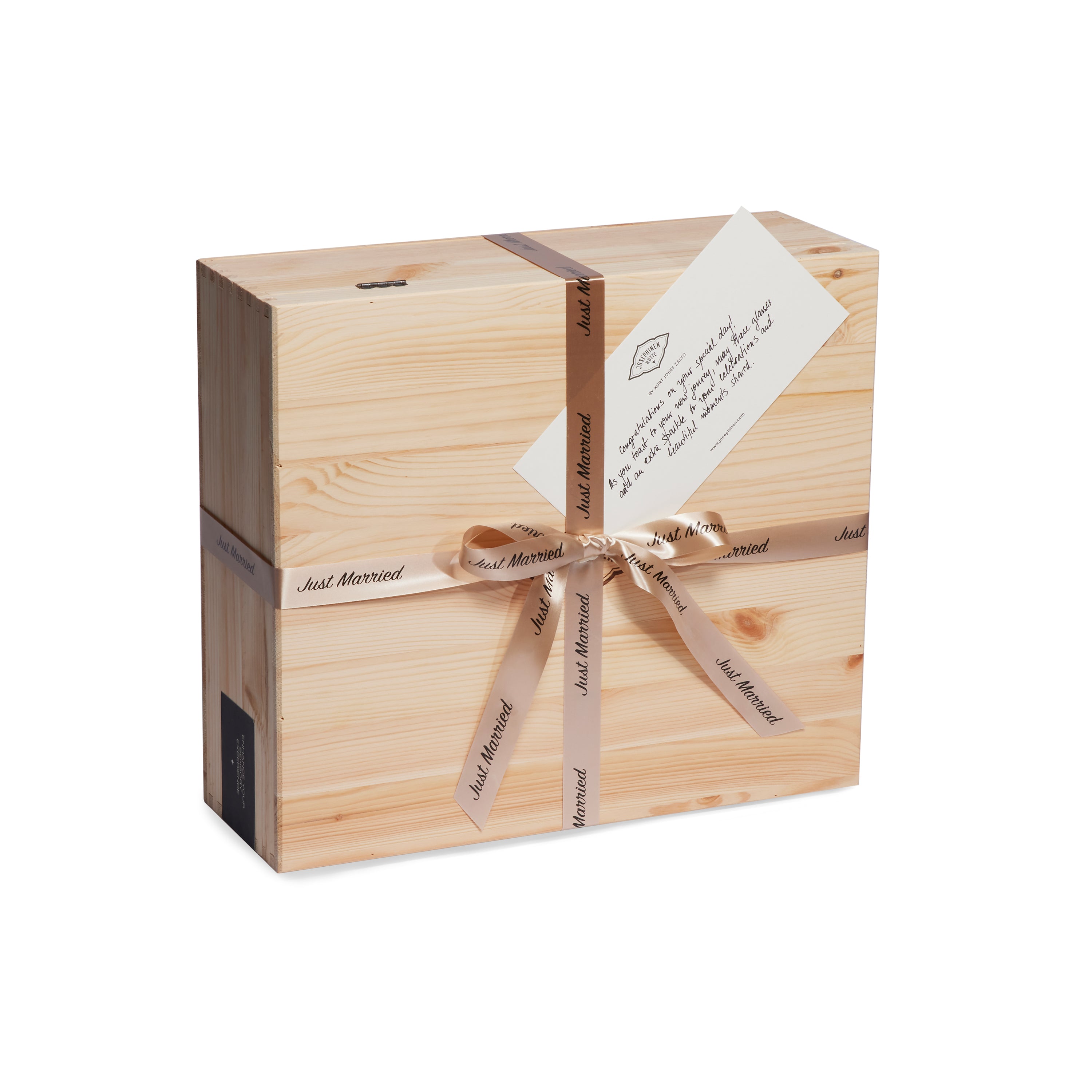 A Josephinenhütte wedding gift box, beautifully wrapped with a "Just Married" ribbon and a card attached. The wooden box exudes a rustic charm, perfect for a wedding gift. Inside are two JOSEPHINE No 4 champagne glasses.